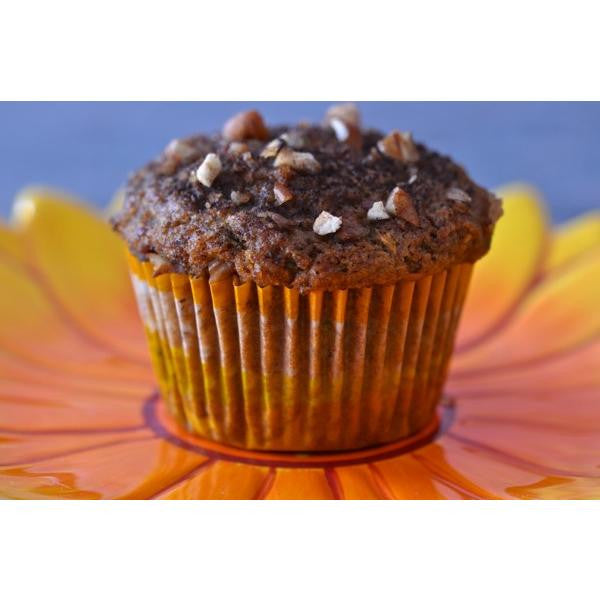 Gluten-free muffin mix by gfJules in a colorful packaging, showing the ready-to-bake muffin batter in a mixing bowl.