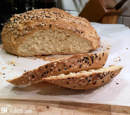Gluten-free bread mix by gfJules featuring a bag of gfJules gluten free bread mix on a wooden surface.