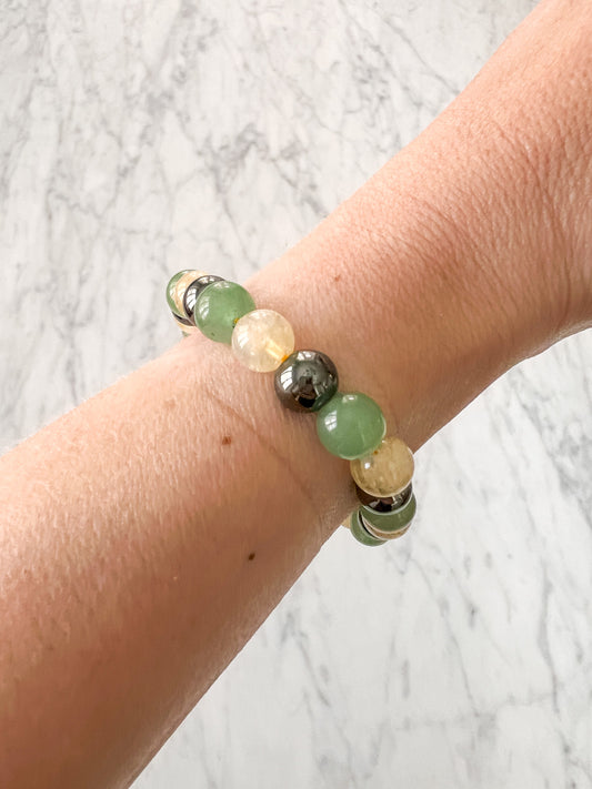 Healing bracelet featuring Citrine and Green Aventurine beads, designed for positive energy and healing.