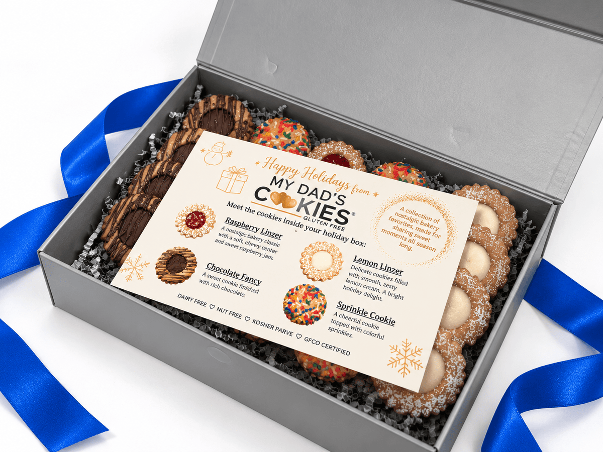 Box of My Dad's Cookies Holiday Bakery Favorites with blue ribbon, featuring assorted cookies in festive packaging.