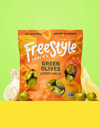 Freestyle Snacks Green Olives with lemon and garlic in a bowl, showcasing the flavorful snack option.