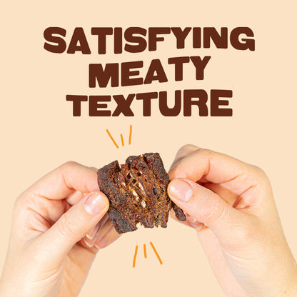 Meaty texture of Pan's Zesty Thai Mushroom Jerky snack with seasoned mushrooms on a white background.
