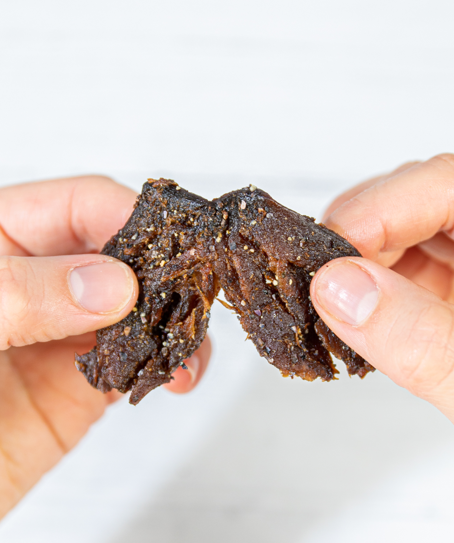Pan's Mushroom Jerky Salt & Pepper Mushroom Jerky showing sliced, seasoned mushroom strips with a meaty texture.