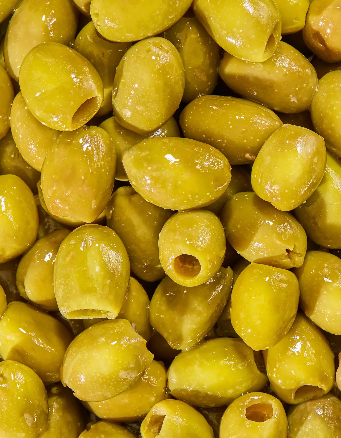 Jar of FreeStyle Snacks Green Olives in brine, showing the original flavor with green olives visible inside the clear container.