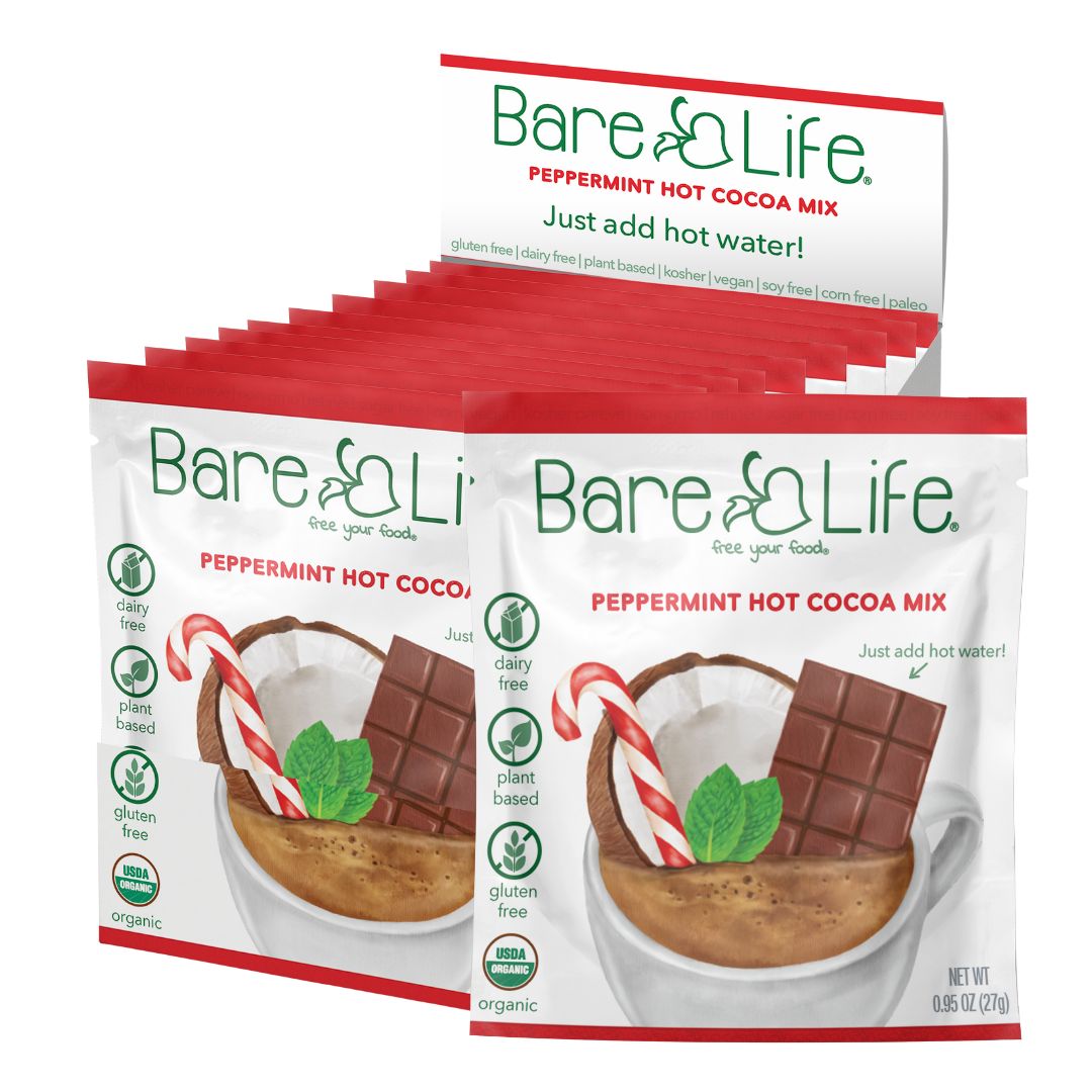 Open single-serving pack of Bare Life dairy-free peppermint hot cocoa mix, gluten-free, vegan, and organic.
