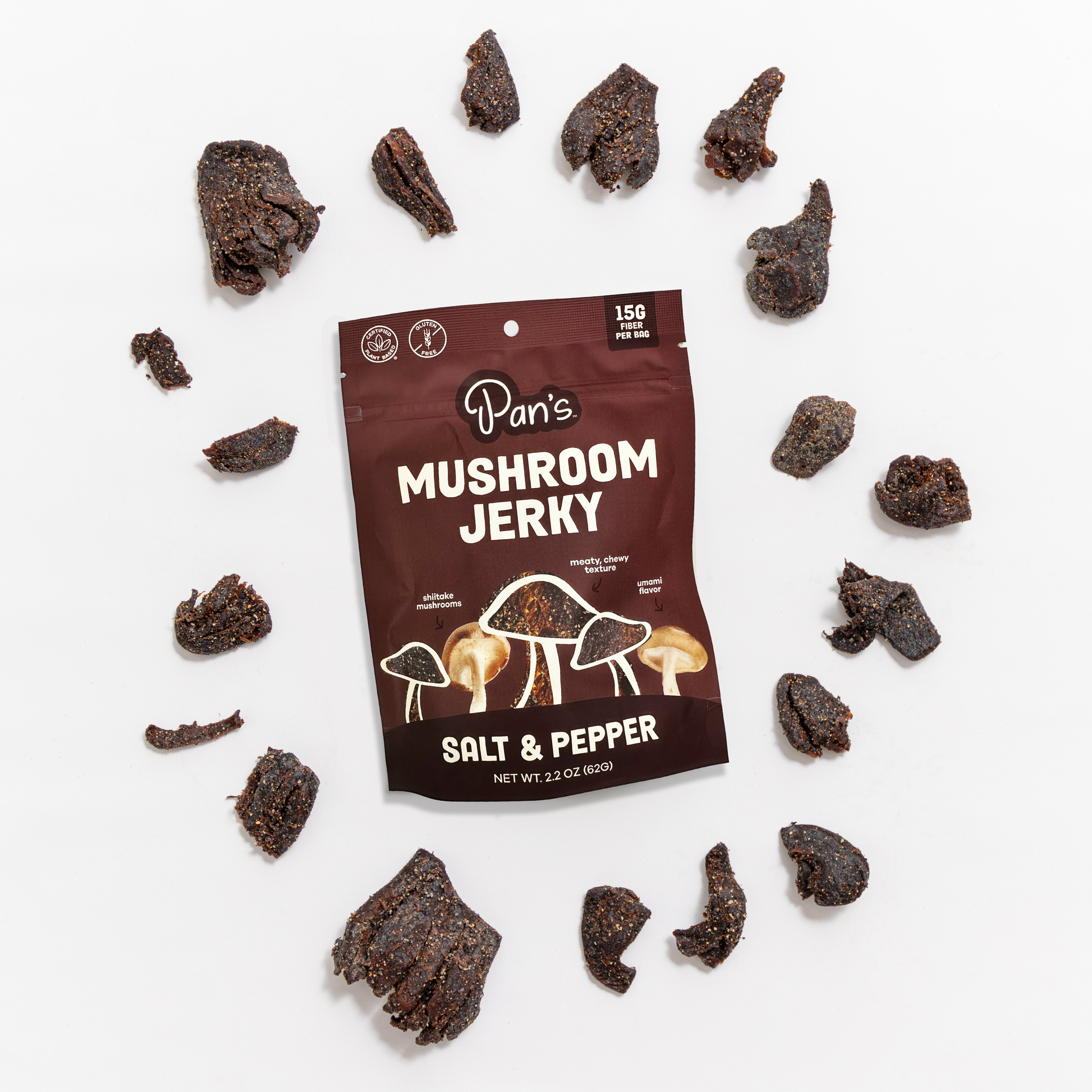 Salt and pepper flavored mushroom jerky by Pan's Mushroom Jerky, showing seasoned mushroom strips on a white background.