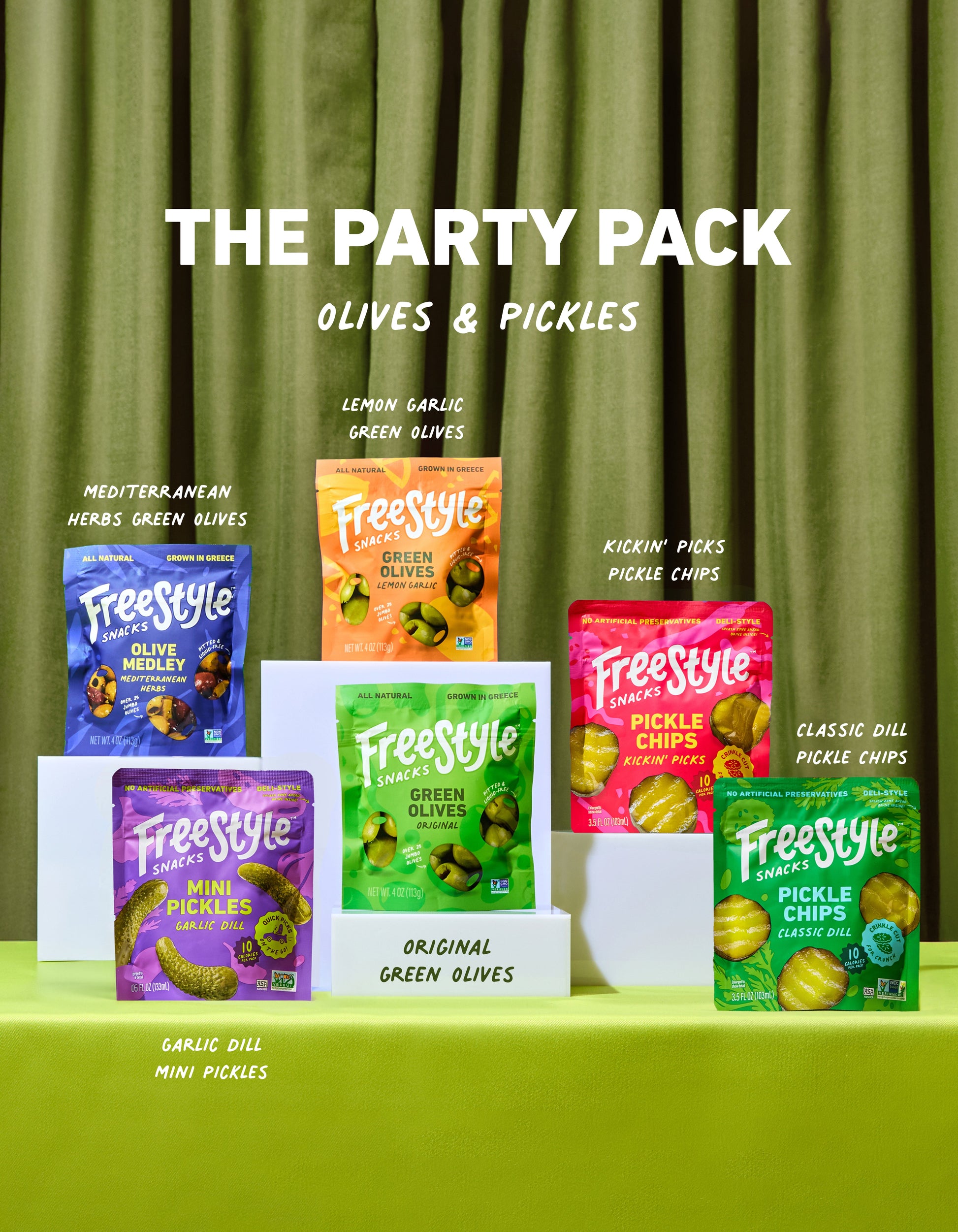 Assorted olives and pickles from FreeStyle Snacks The Party Pack, displayed in a variety of jars and containers.