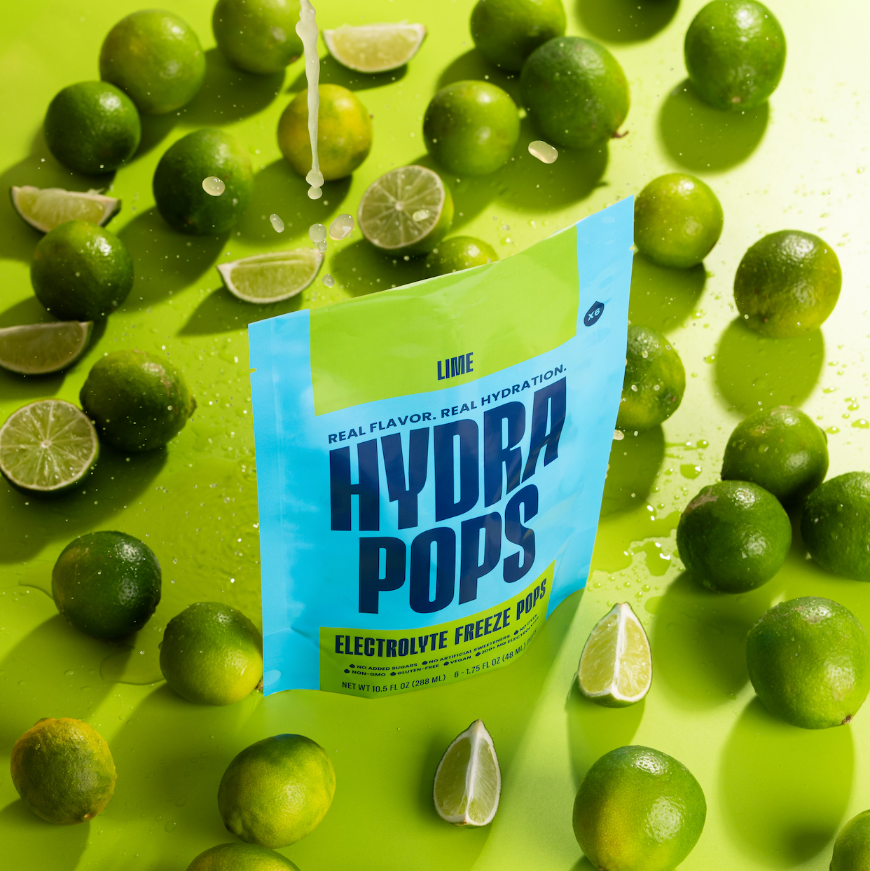 Hydra Hydration Hydra Pops Lime flavor, lime-colored frozen ice pop in clear plastic packaging, refreshing and fruity summer treat.
