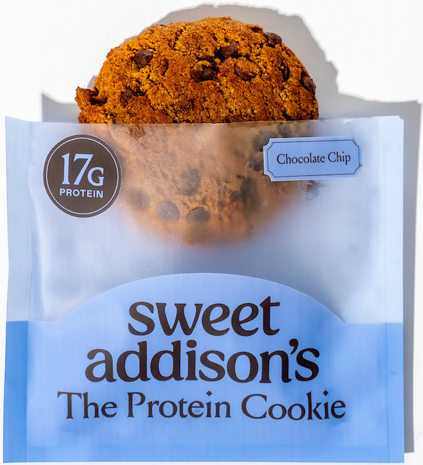 Half-eaten Sweet Addison's Protein Cookie showing texture and chocolate chips, highlighting the 17g protein content.