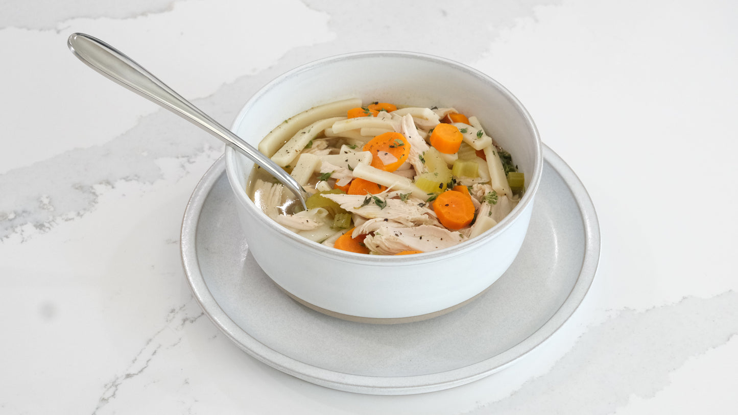 Taste Republic gluten-free egg noodle pasta in 16oz packages, displayed in a family-sized frozen food setting.