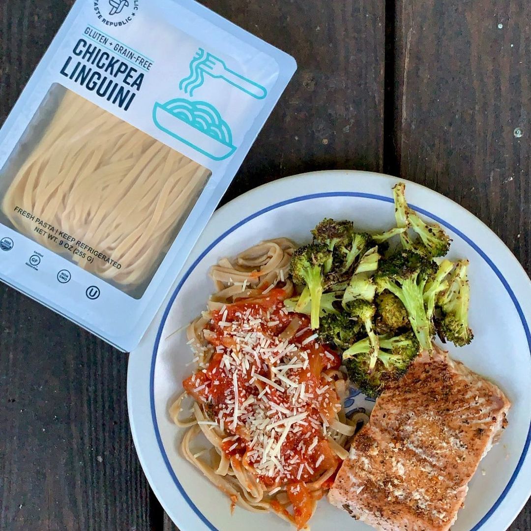 Cooked Taste Republic gluten-free chickpea linguini on a plate, ready to serve, showcasing organic pasta with a fork next to the dish.