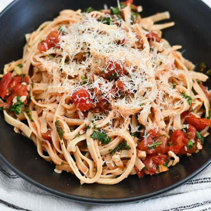 Cooked Taste Republic gluten-free chickpea linguini served on a plate with vegetables and herbs, highlighting organic pasta.