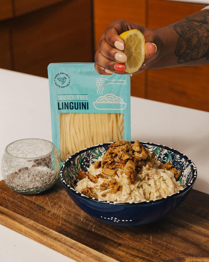 Fresh gluten-free linguini pasta from Taste Republic Gluten-Free, showcased in a lifestyle setting with a bowl of cooked pasta.