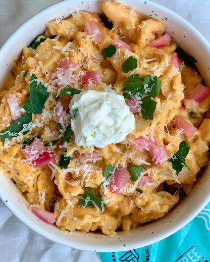Fresh gluten-free fusilli pasta from Taste Republic Gluten-Free, shown in a recipe setting with cooked pasta on a plate.