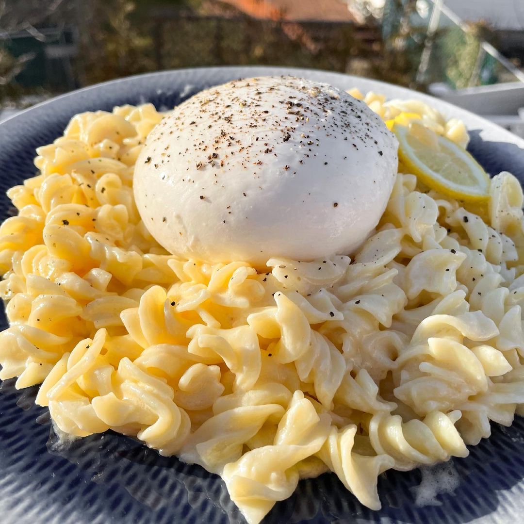 Fresh gluten-free fusilli pasta from Taste Republic gluten-free brand, shown in a recipe setting with a fork and bowl.
