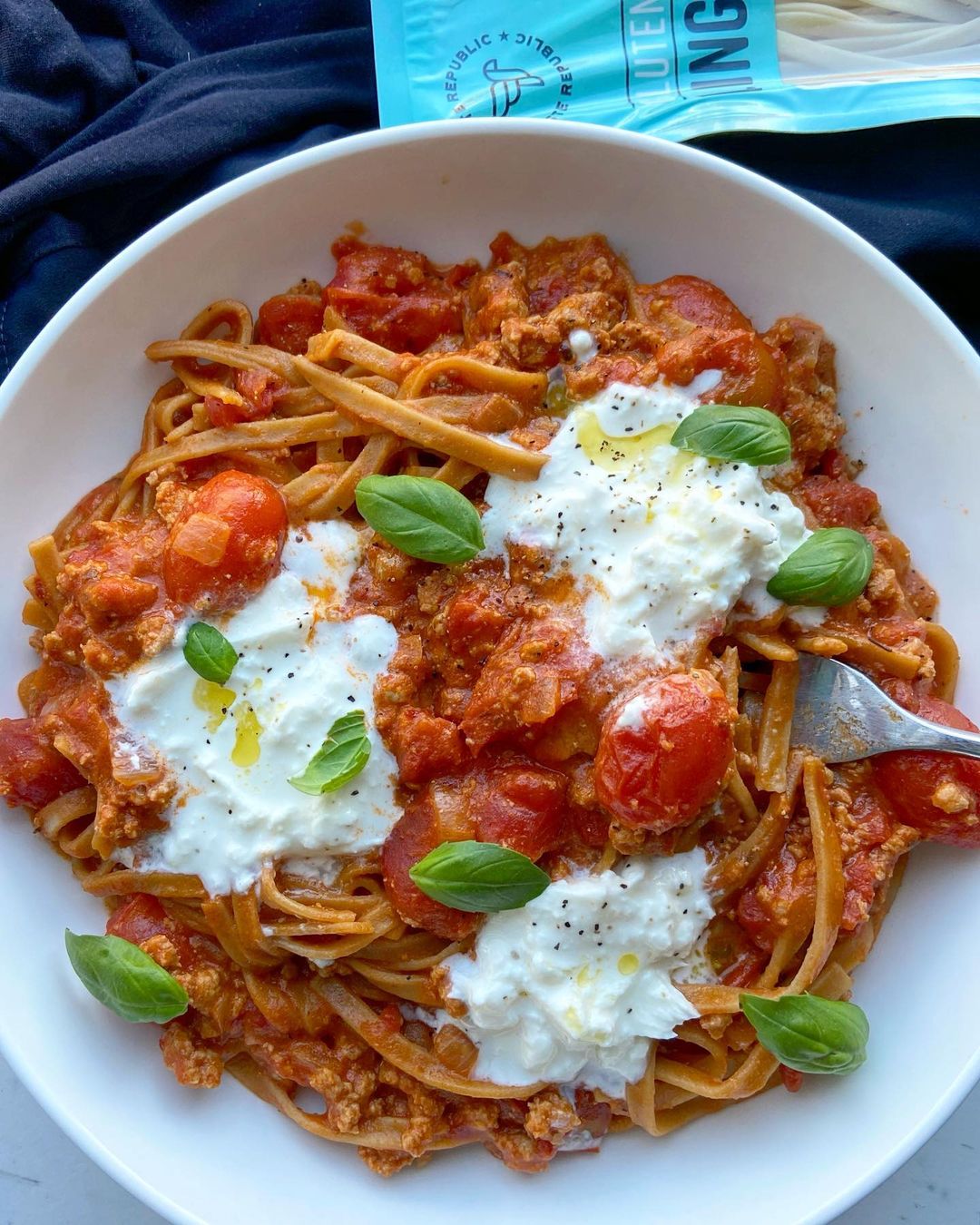 Fresh gluten-free linguini pasta from Taste Republic, displayed with a delicious prepared dish on a plate.