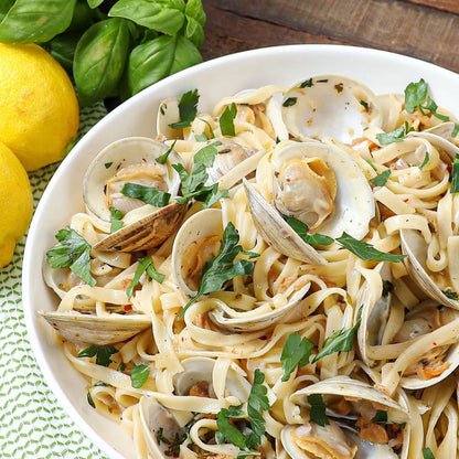 Taste Republic gluten-free linguini pasta in a 6-pack, shown on a plate with a flavorful sauce, perfect for gluten-free Italian dishes.