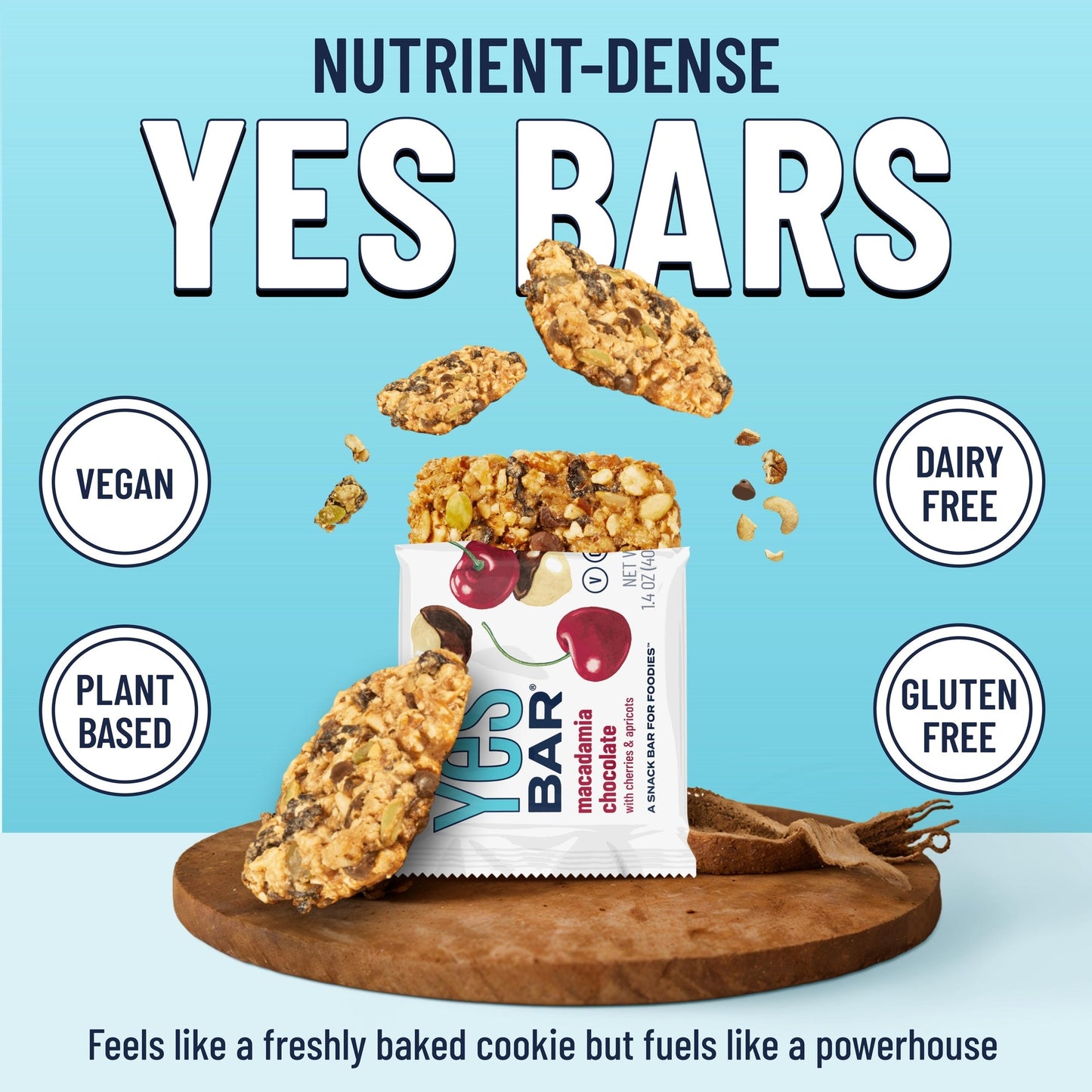 YES BAR Macadamia Chocolate energy bars in a 6-pack, featuring creamy chocolate coating with crunchy macadamia nuts.