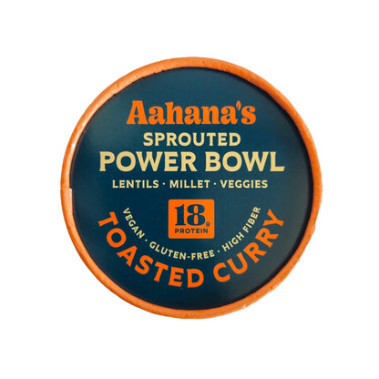 Sprouted mung beans and rice bowl with toasted curry from Aahana's Naturals, garnished with herbs in a bowl.