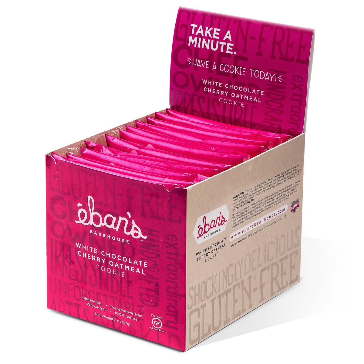 Open packaging of Eban's Bakehouse white chocolate cherry oatmeal cookies, showing golden cookies with white chocolate and cherry pieces.
