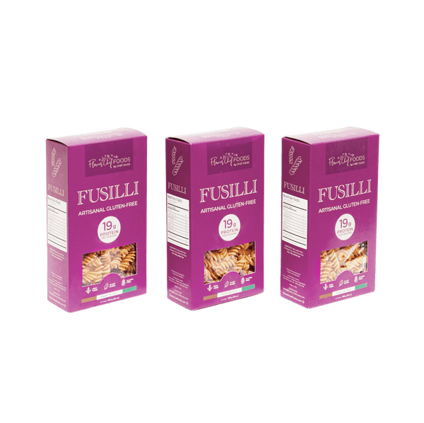 Pack of three artisanal gluten-free, high-protein fusilli pasta by Flower Chef Foods, arranged in a clear view.