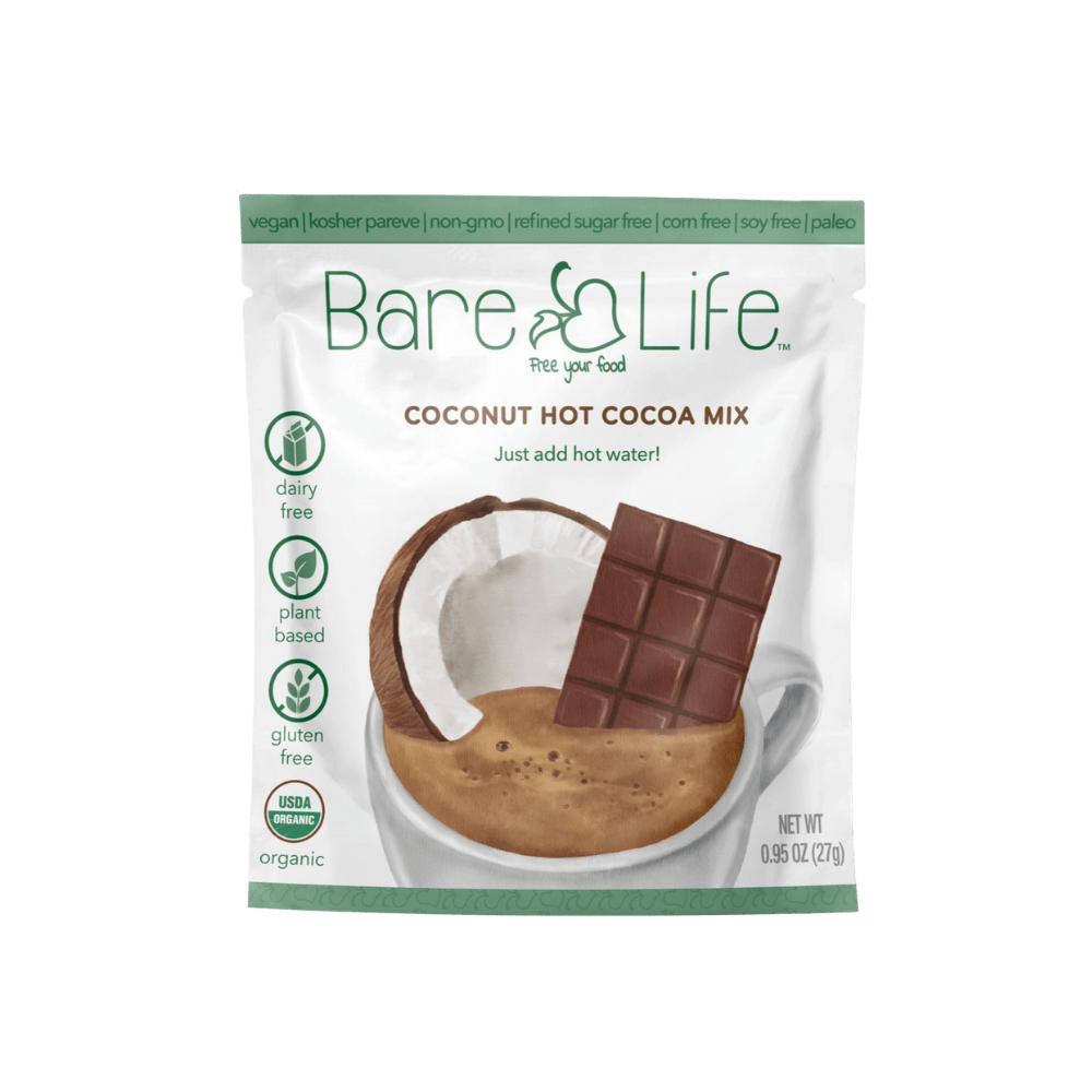 Bare Life dairy-free coconut hot cocoa mix packets, 20-pack, with chocolate powder and coconut flavor in individual sachets.