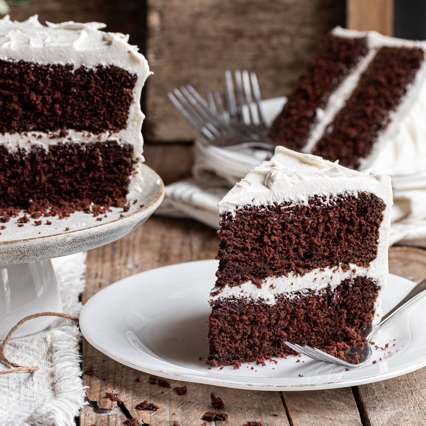 gfJules gluten free birthday cake mix in a box, showcasing a chocolate cake with festive decorations and ingredients.