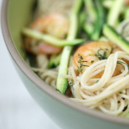 Jovial Gluten Free Brown Rice Capellini pasta with shrimp and dill, cooked and plated for a meal presentation.