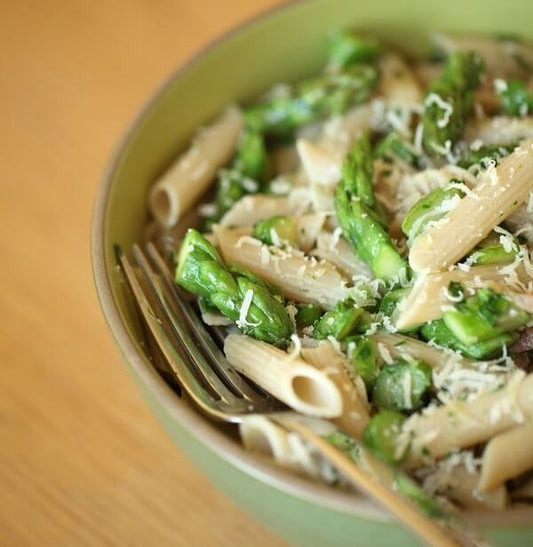 Single serving of Jovial Gluten-Free Brown Rice Penne pasta in a clear container, showcasing the pasta's brown color and texture.