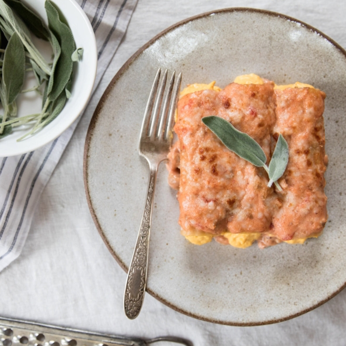 Jovial Gluten Free Brown Rice Manicotti with butternut squash and tomato filling in a baking dish, ready for cooking.