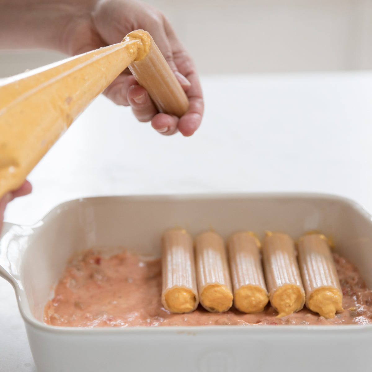 Jovial gluten-free brown rice manicotti filled with butternut squash and tomato, ready for cooking.