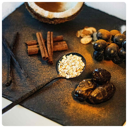 LÜME Cinnamon Almond Granola in a bowl with visible cinnamon and almond pieces