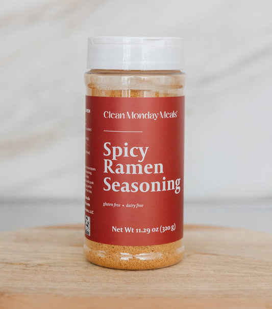 Spicy ramen seasoning packet from Clean Monday Meals, featuring vibrant red and orange packaging with a bowl of spicy ramen noodles.