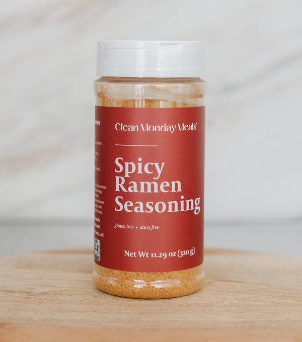 Spicy ramen seasoning packet from Clean Monday Meals, featuring vibrant red and orange packaging with a bowl of spicy ramen noodles.