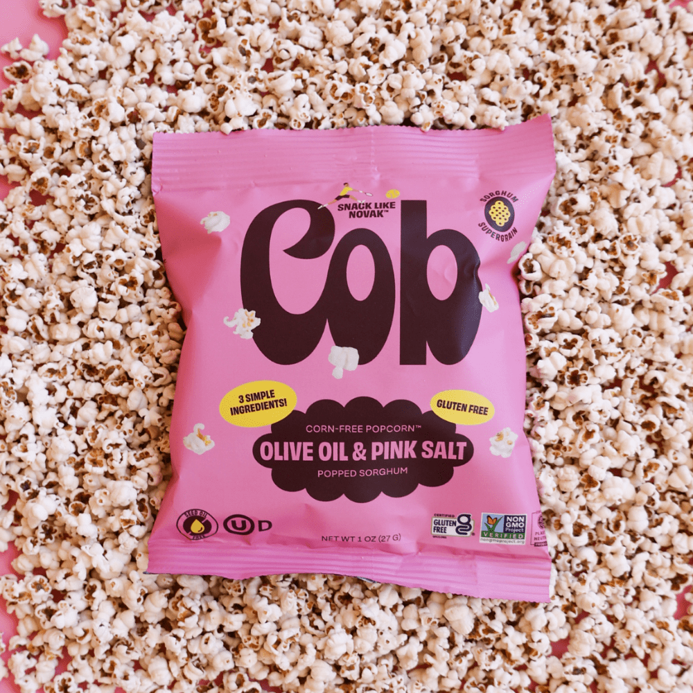 Popped sorghum snack with Cob Foods olive oil and pink salt, showing crispy, golden popped sorghum pieces in a close-up image.