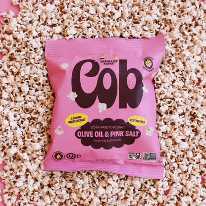 Popped sorghum snack with Cob Foods olive oil and pink salt, showing crispy, golden popped sorghum pieces in a close-up image.