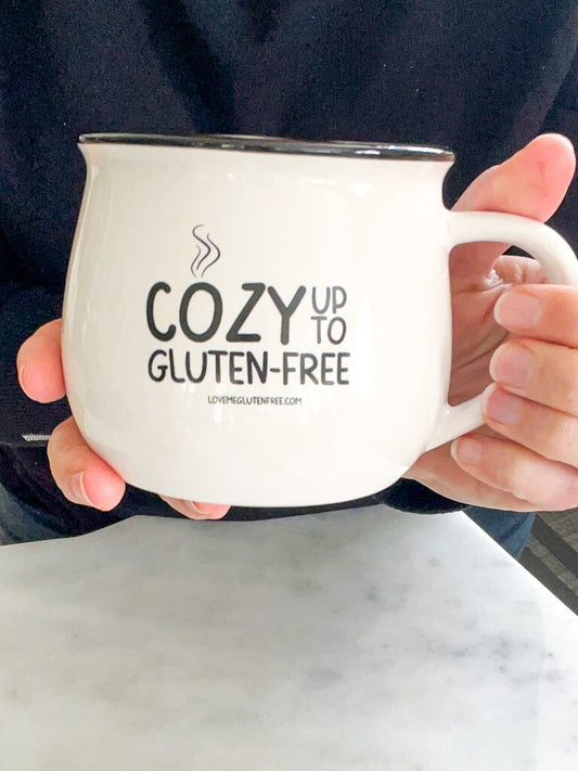 Love Me Gluten Free Cozy Mug featuring a warm, inviting design perfect for coffee or tea. Ceramic mug with a comfortable handle.