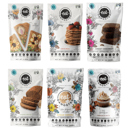 Eat G.A.N.G.S.T.E.R. Starter Sampler from Eat G.A.N.G.S.T.E.R. Shop, featuring a variety of snack samples on a wooden surface.