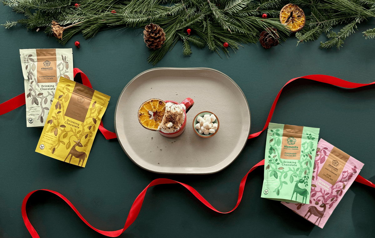 Elements Truffles Jupiter vegan hot chocolate gift box with assorted chocolates, stylish packaging, perfect for gifting.