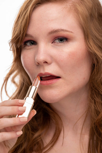 EpiLynx Color-Changing Flower Lip Gloss in a clear tube, showcasing vibrant, hydrating vegan and gluten-free lip balm with floral design