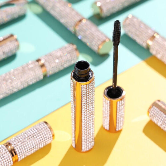 EpiLynx Mega Volume Vegan Mascara with handmade diamond case, showing the smudge-proof formula and full brush applicator.