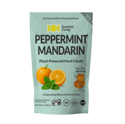 Essential Candy Peppermint Mandarin botanical lozenges in a clear hard candy form, featuring red and white swirls.