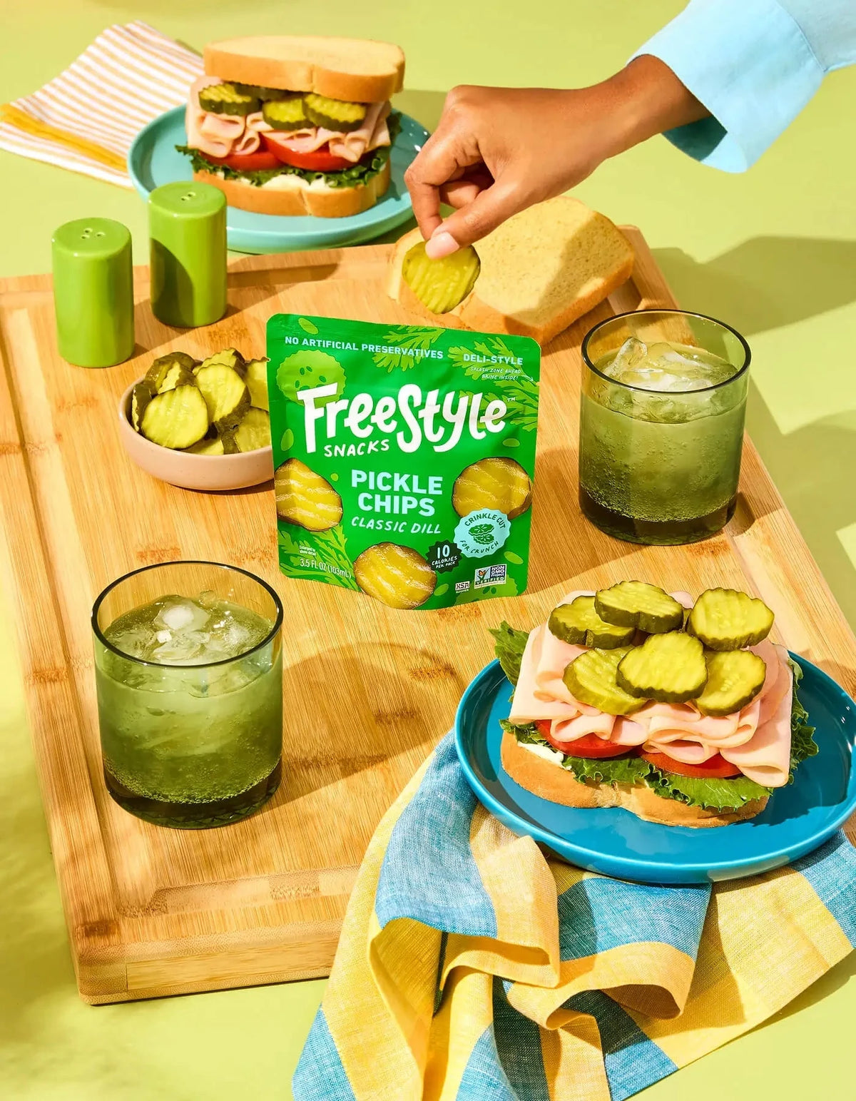 Freestyle Snacks Classic Dill Pickle Chips in a bowl, showcasing crispy pickle-flavored snack chips on a white background.