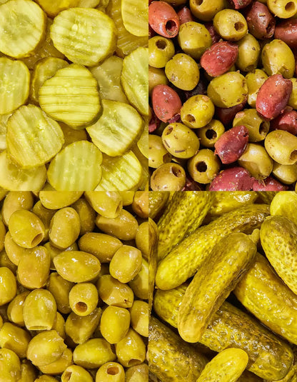 Assorted pickles and olives from FreeStyle Snacks The Party Pack, displayed in clear containers on a white background.