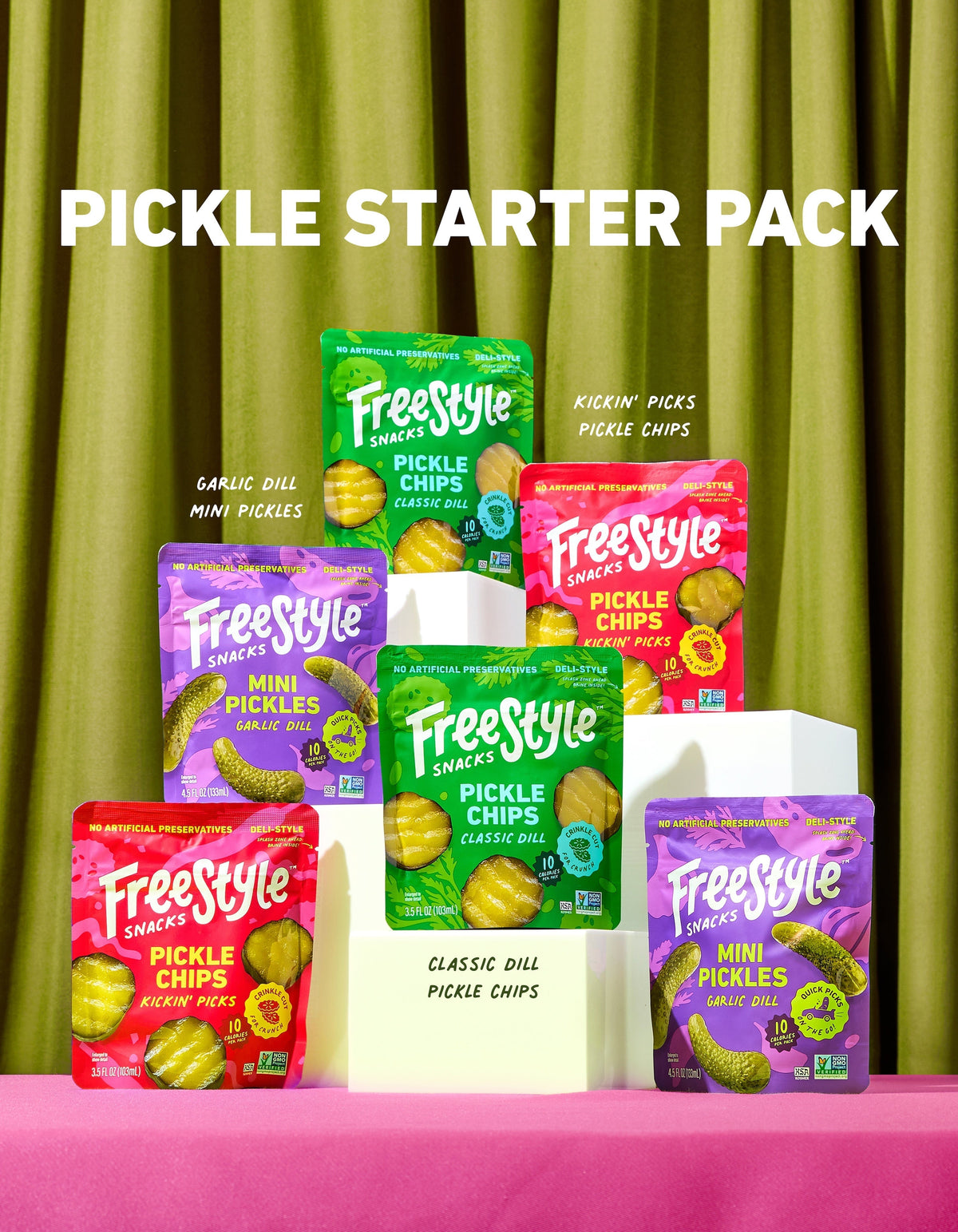 Assorted Freestyle Snacks pickle starter pack with various pickle jars on a wooden surface.