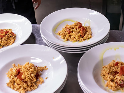 Cooked Flower Chef Foods high protein fusilli pasta served on dinner plates, ready to enjoy a nutritious meal.