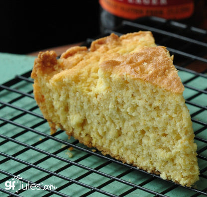gfJules gluten-free cornbread mix in a bowl, with ingredients and baking utensils around, ready for baking.