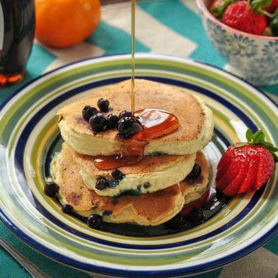 gfJules gluten-free pancake and waffle mix served with syrup on a plate, ready for breakfast.