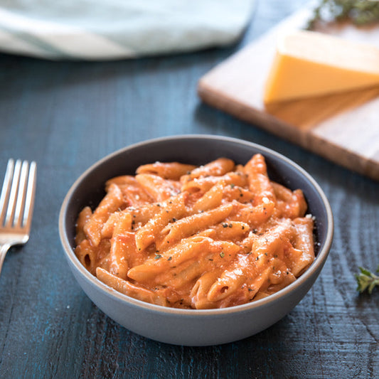 Gluten-free Jovial Brown Rice Penne Rigate cooked with tomato sauce and three cheeses in a one-pot meal