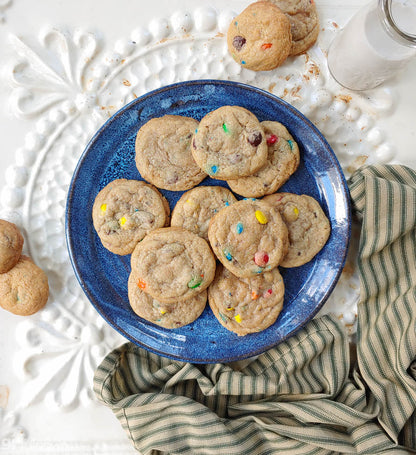 gfJules gluten-free cookie mix with freshly baked cookies on a towel, ready to enjoy homemade gluten-free treats.